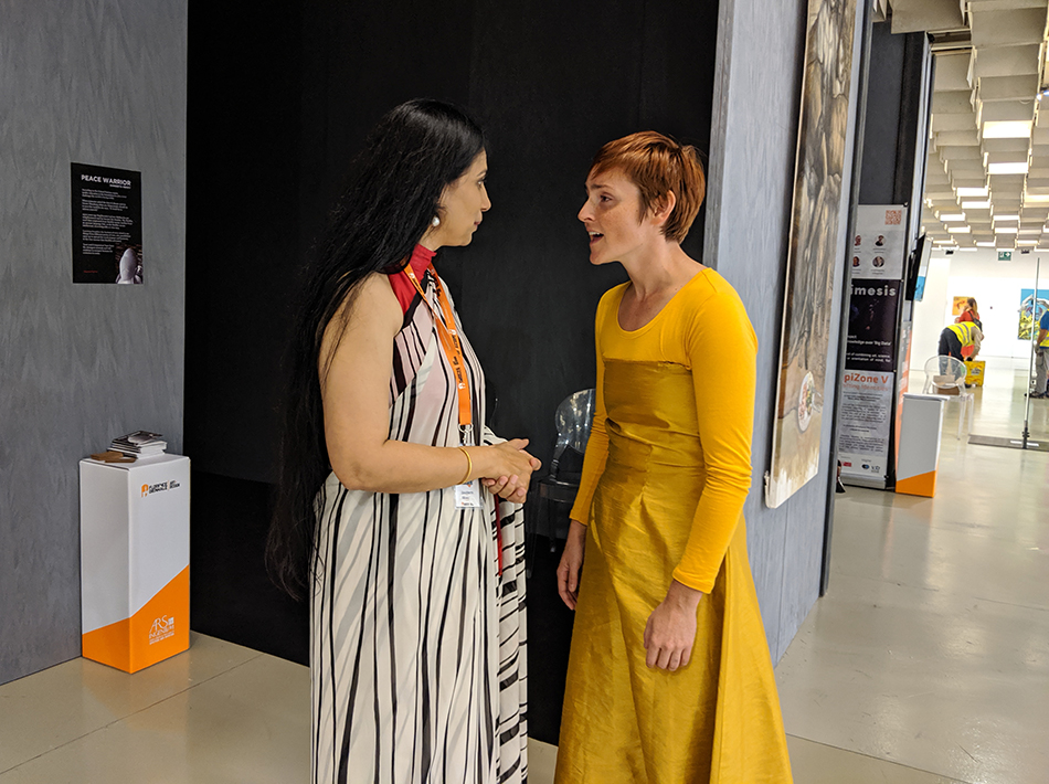 Sangeetha Abhay Discussing her Sculpture With Visitor in Florence Biennale